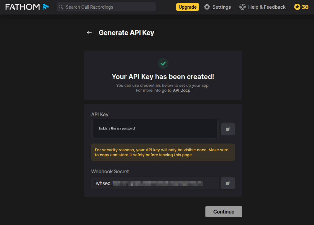 The created-key screen showing an API Key field and a Webhook Secret field, with the key blacked out